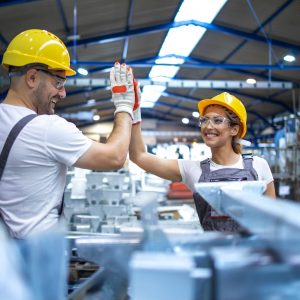 factory-workers-greeting-each-other-for-successful-teamwork